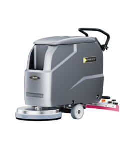 Technician performing floor scrubber maintenance